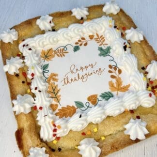 Sugar cookie cake with Happy thanksgiving and fall leaves