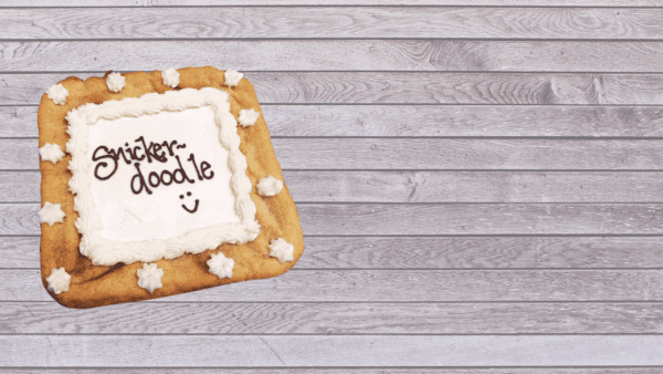 Snickerdoodle cookie text on gray board